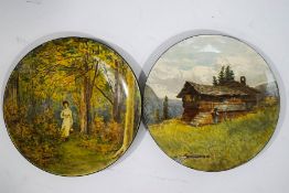 A pair of Doulton Lambeth stoneware plates, one painted with a lady in woodland,