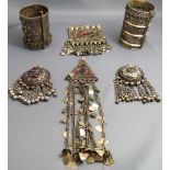 A collection of Middle Eastern or Indian white metal jewellery, including a pair of cuffs.