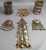 A collection of Middle Eastern or Indian white metal jewellery, including a pair of cuffs.