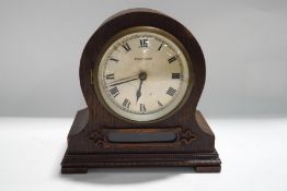 An early 20th century Bulle mantel clock, oak cased with visible escapement, Serial No.