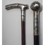 A silver topped walking cane, the handle engraved with sailing vessels and dated 1921,