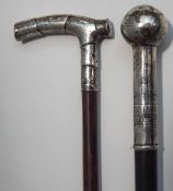 A silver topped walking cane, the handle engraved with sailing vessels and dated 1921,