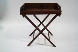 A 19th century oak butlers tray and folding stand, 75cm wide,