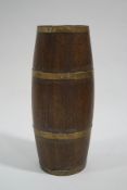 An oak and brass bound barrel stick stand,