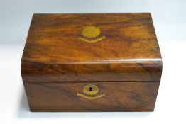 A Victorian walnut sewing box with interior removable tray,