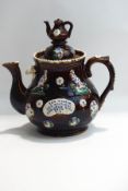 A Victorian Bargeware teapot and cover,