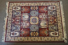 A Kashan style carpet, with compartentalised flowering vases within one wide border,