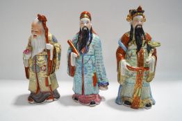 Three Chinese porcelain figures of Immortals,
