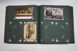 A postcard album of Victorian and later cards, including WWI, HMS war ships, steam railway,