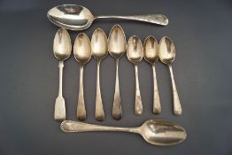 A collection of silver spoons,