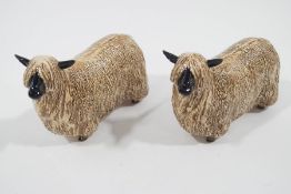 A pair of Beswick black faced rams with long hair, printed factory mark,