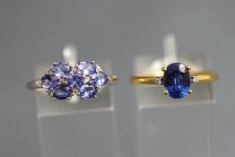 A 9 carat white gold seven stone tanzanite dress ring, with diamond points between,
