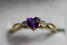 An amethyst and diamond 9 carat gold ring,