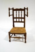 A North Country ash spindle back child's chair, with rush seat,