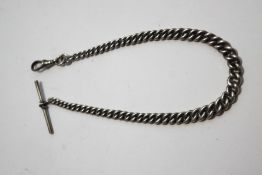 A silver Albert watch chain, of graduated curb links, with swivel and T bar, 31 cm long, 33.