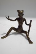 An African patinated brass seated figure, circa 1930's,