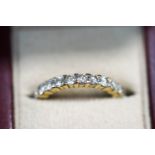 A diamond eternity ring, unmarked, the twenty four brilliant cuts totalling approximately 1.