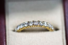 A diamond eternity ring, unmarked, the twenty four brilliant cuts totalling approximately 1.