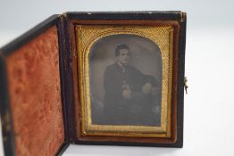 A Victorian Ambrotype of a seated gentleman, 6.