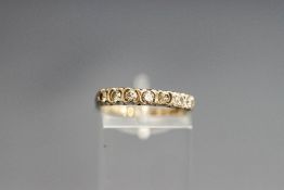 An 18 carat gold seven stone diamond half eternity ring,