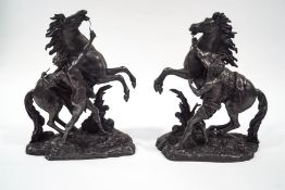A pair of large spelter figure groups of Marley horses,