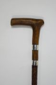 A malacca walking stick with wooden handle, 2 silver collars,