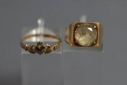 A 9 carat gold Claddagh ring, finger size N; and a 9 carat gold quartz ring; 5.