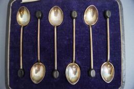 A set of six Walker & Hall silver bean end coffee spoons, 37 g gross,