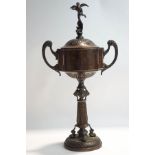 A copper replica trophy and cover, engraved with 'The Star International Outboard Boat Trophy,