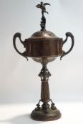A copper replica trophy and cover, engraved with 'The Star International Outboard Boat Trophy,