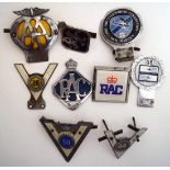 Seven car badges including AA,