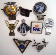 Seven car badges including AA,