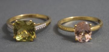 A 9 carat gold gem set dress ring, with stone set shoulders,