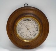 A French oak cased circular barometer, the dial signed Maison de L'lngr Chevallier,