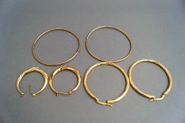 Three pairs of 9 carat gold hoop earrings, 10.