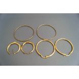 Three pairs of 9 carat gold hoop earrings, 10.