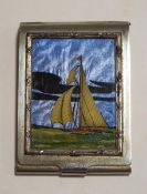 A 1920's silver plated vesta case with a painted scene of a sailing ship