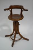 A 1930's bentwood clerk's chair, with swivel seat,