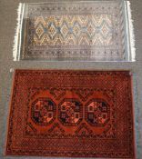 A small Middle Eastern blue ground rug, 147cm x 89cm and a red ground rug,