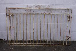A pair of painted wrought iron gates,