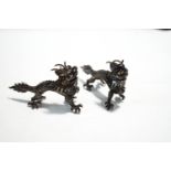 A pair of Chinese export silver dragon menu holders, by Wang Hing, stamped Latin makers mark,