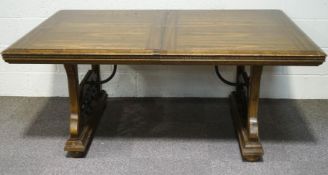A Mexican dining table with two trestle ends, linked by mutual stretchers,