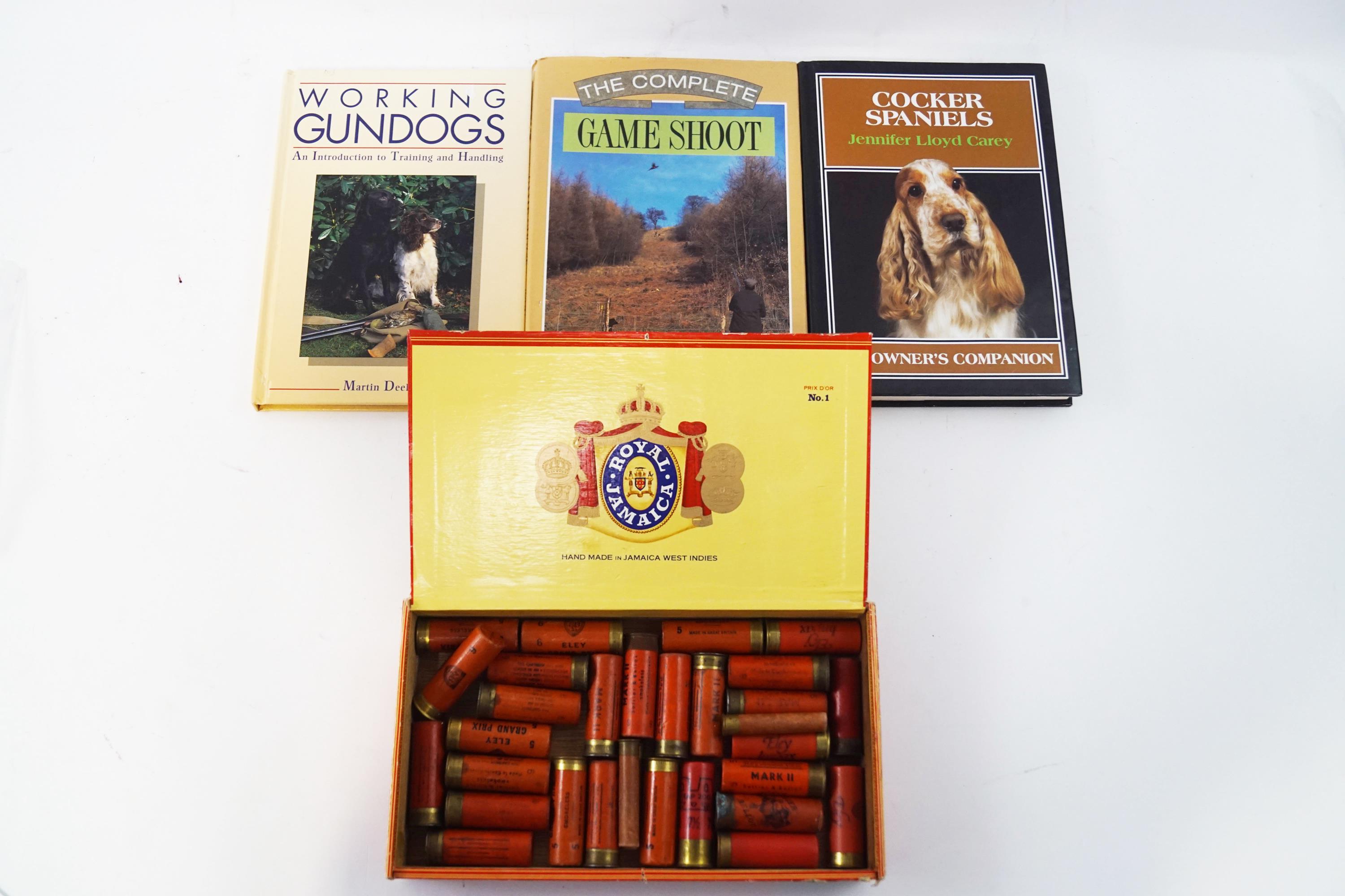 A collection of vintage cartridges and three shooting related books