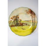 A Royal Doulton fox hunting scene plate with shaped edge, printed factory marks, 26.