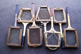 A collection of seven vintage tennis racquets,
