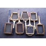 A collection of seven vintage tennis racquets,