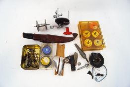 Assorted tackle, including a tin of lures, line,