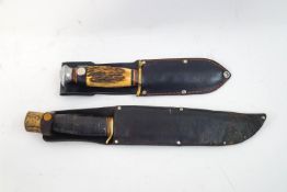A horn and leather handled hunting knife and another
