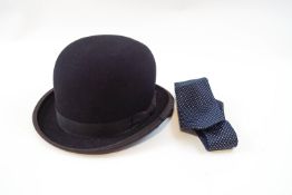 A child's bowler hat and stock