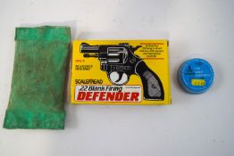 A Scalemead .22 blank firing Defender (unused), a tin of .